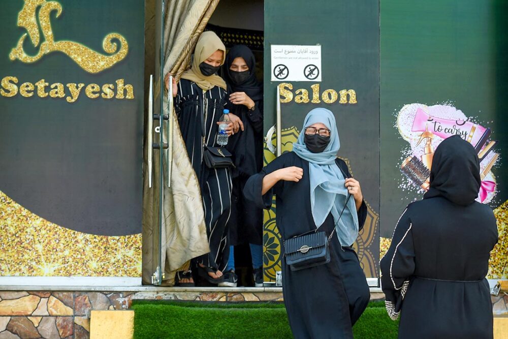 Women rights in Afghanistan - Veiled women leave a beauty salon in Kabul, Afghanistan