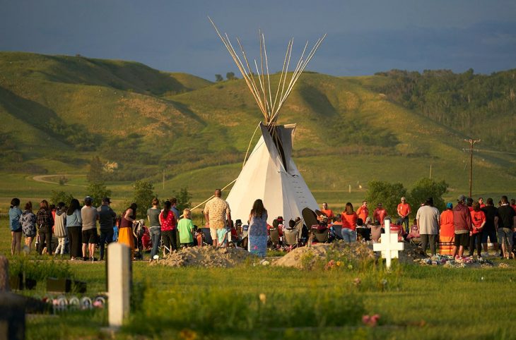 Indigenous ceremony near the graves of children who were victims of Canadian residential schools during the colonial era