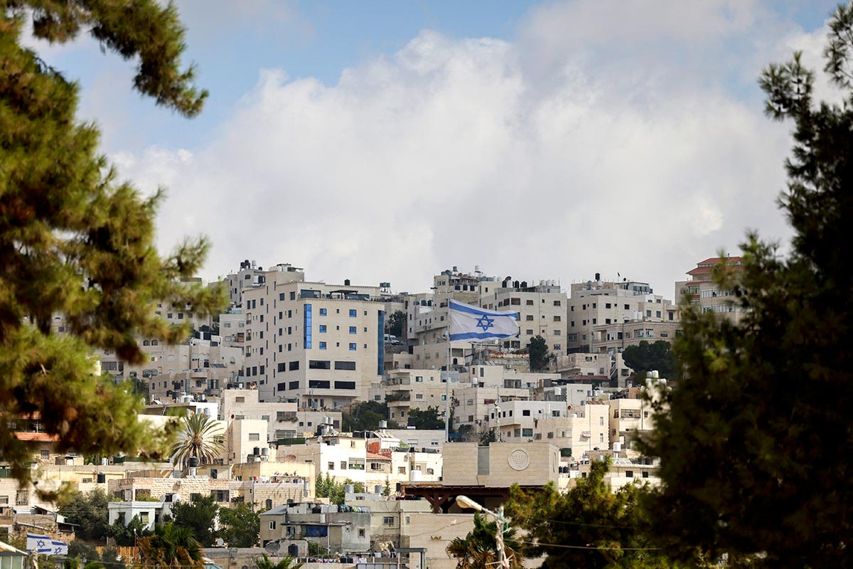 An Israeli flag flies over the Beit Romano settlement in the city of Hebron, in the occupied West Bank.