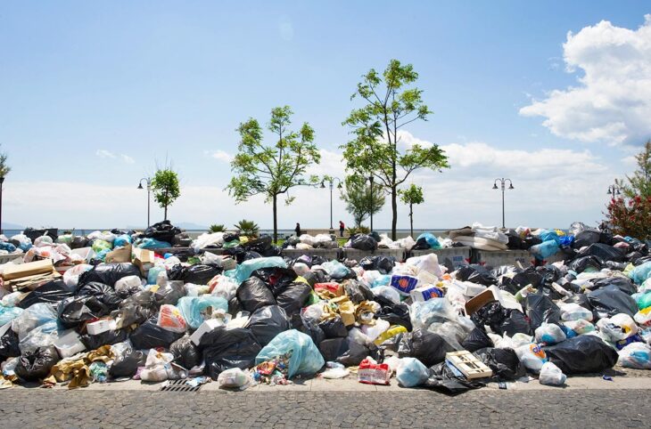 Ecomafias and waste-related crime in Italy. Photo: A pile of rubbish bins and other waste in a street in Naples.