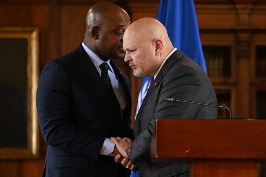 Karim Khan and the ICC are under pressure - Photo: Karim Khan listens to Luis Fernando Murillo whisper in his ear as he shakes his hand during a visit to Colombia.