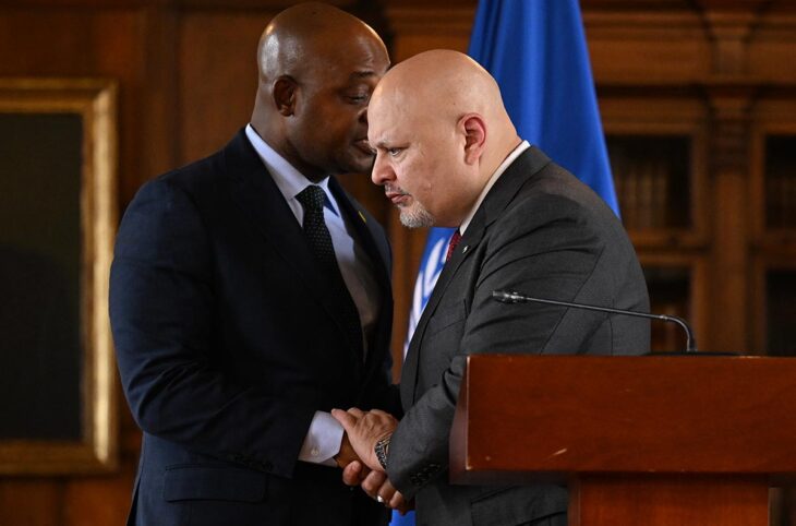 Karim Khan and the ICC are under pressure - Photo: Karim Khan listens to Luis Fernando Murillo whisper in his ear as he shakes his hand during a visit to Colombia.