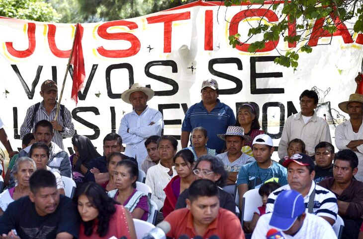 Parents and peers of killed or missing students during a press conference on October 6, 2014 in Ayotzinapa, Mexico. Authorities discovered over the weekend six adjoining pits containing 28 bodies, some badly burned and in pieces, on a hill outside the Guerrero state city of Iguala, where the students were last seen.