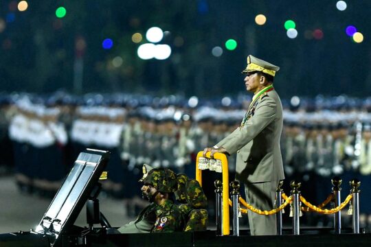 Myanmar - International Criminal Court (ICC) arrest warrant for General Min Aung Hlaing. Photo: The Burmese Head of State standing in uniform in a vehicle during a military parade.