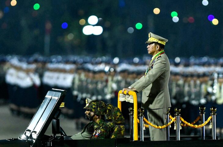 Myanmar - International Criminal Court (ICC) arrest warrant for General Min Aung Hlaing. Photo: The Burmese Head of State standing in uniform in a vehicle during a military parade.