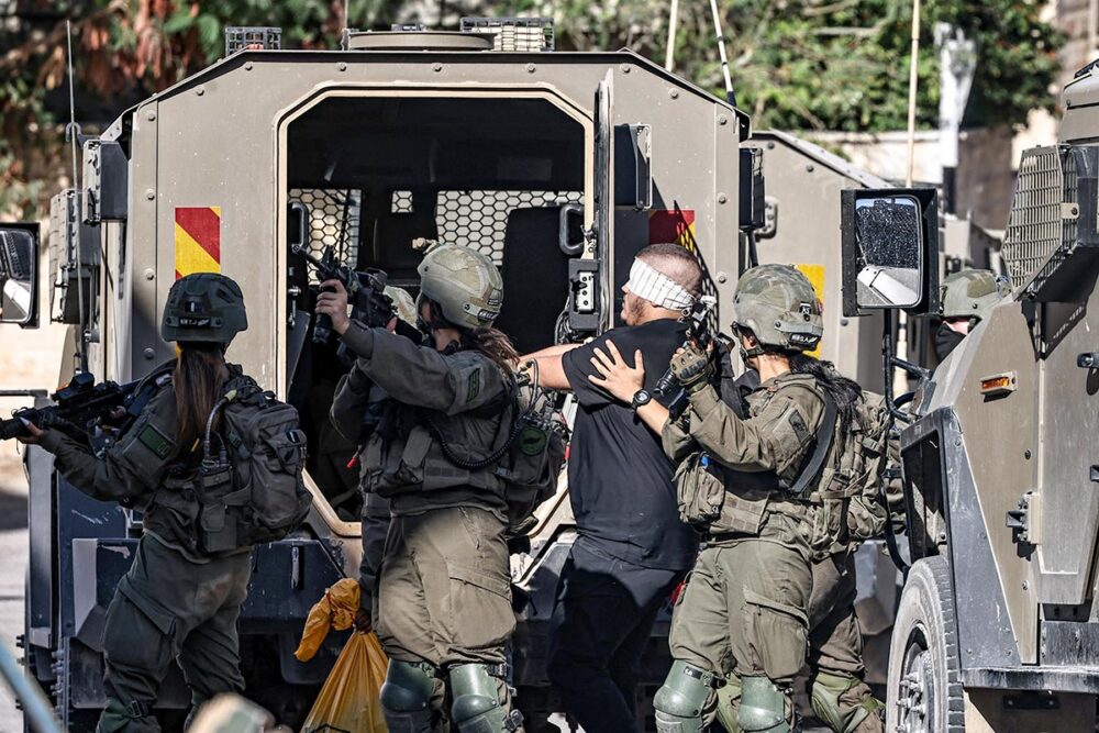 Israel’s impunity with Palestinian detainees - Photo: Israeli army soldiers arrest a blindfolded man in Tubas in the north of the occupied West Bank.