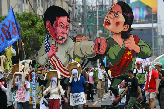 The ICC investigation in the Philippines is stalling. It is targeting crimes attributed to former president Rodrigo Duterte's bloodthirsty anti-drug war. But a political battle is raging between current president Ferdinand Marcos Jr and his vice-president Sara Duterte, the former president's daughter. Photo: In a Manila street, two effigies of Duterte and Marcos fight during a demonstration.