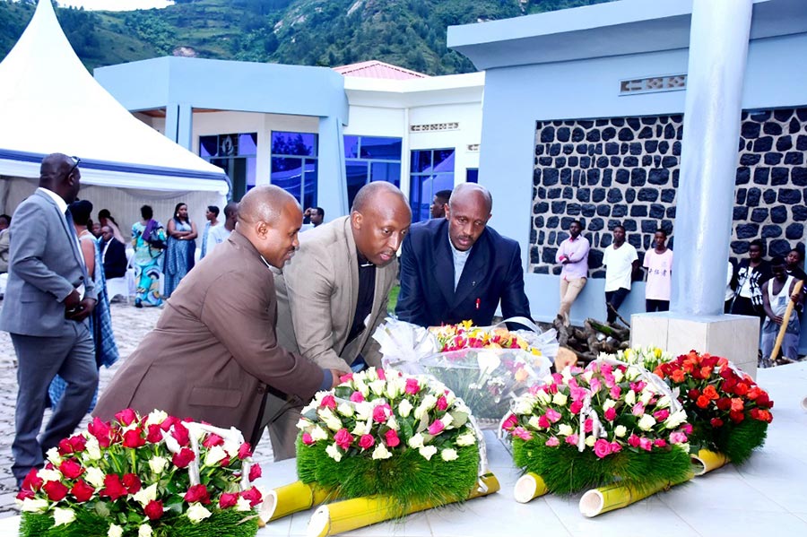 Survivors of the genocide lay a wreath at the 