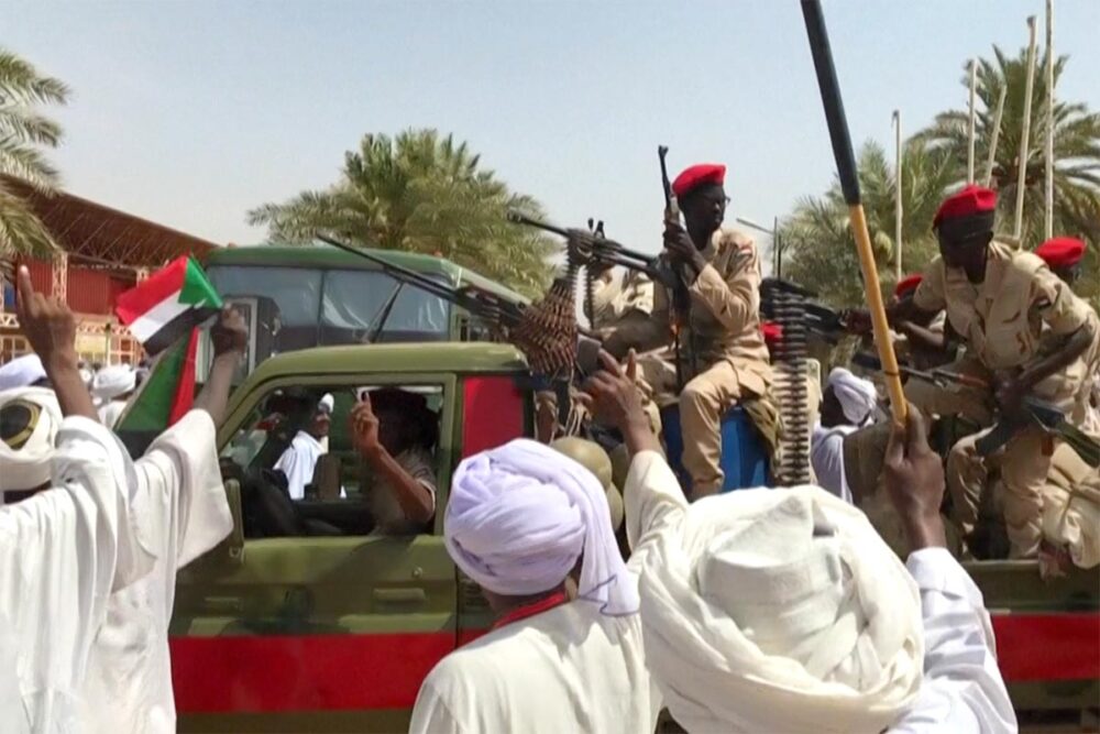 Sudan has filed a genocide claim against the United Arab Emirates (UAE) with the International Court of Justice (ICJ). Photo: Soldiers from the Rapid Support Forces in a combat vehicle are greeted by Sudanese in Khartoum.