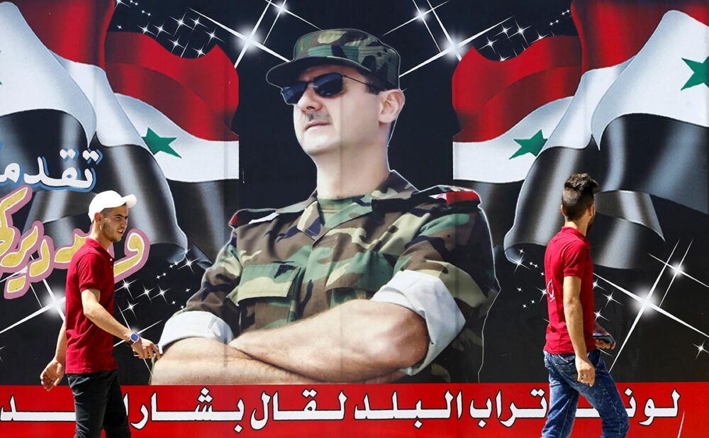 Procès syrien en France. Photo : affiche de Bachar el-Assad dans une rue de Damas en Syrie.