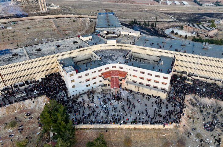 ICC & Syria - An aerial photo shows people gathering around Saydnaya prison in Syria.