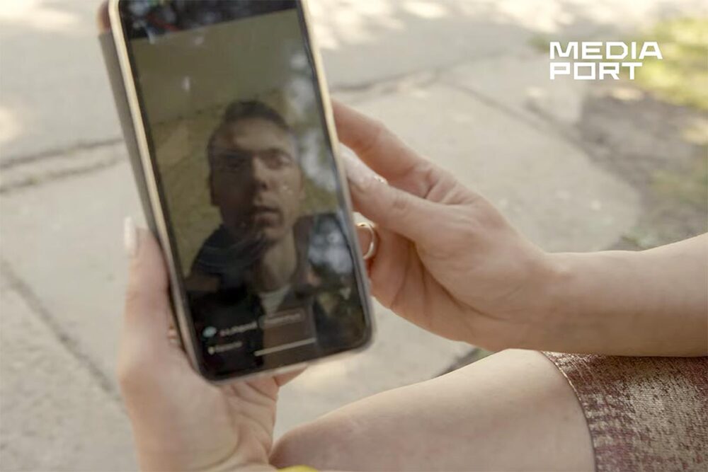 Enforced disappearances in Ukraine - The mother of the missing Andrii Shapoval shows a video of her son on her phone.