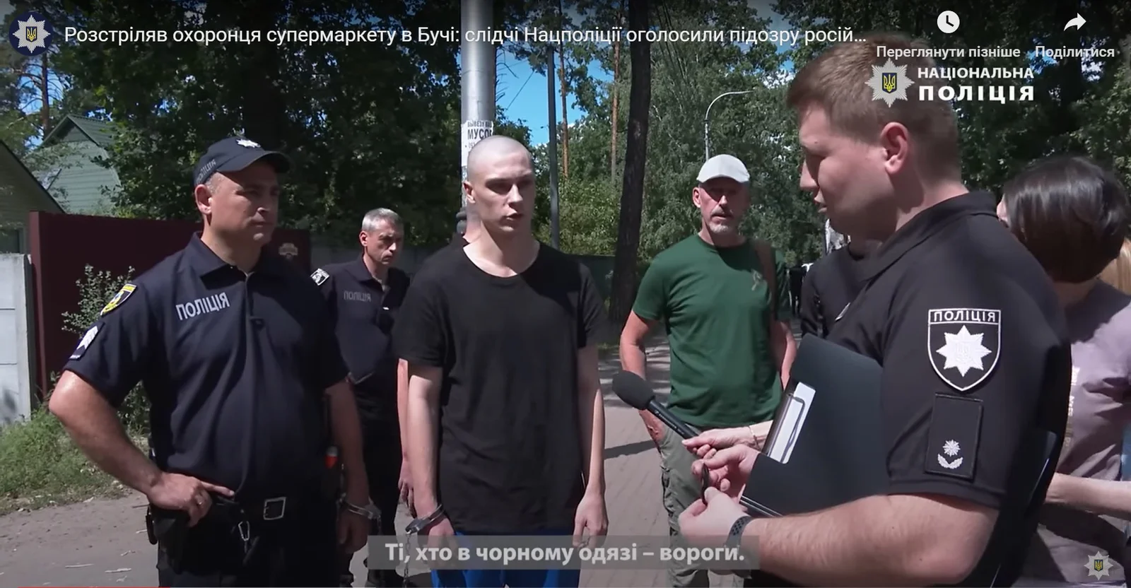 The accused Nikolai Kartashov, during the crime scene reconstruction organized by Ukrainian investigators. 